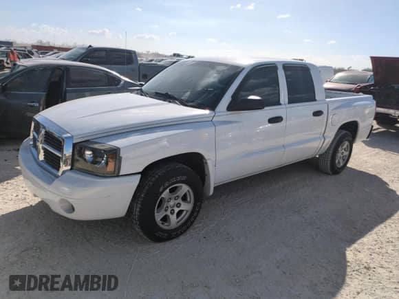 2006 Dodge Dakota SLT z VIN 1D7HE48NX6S636343, wystawiony jako Copart lot #77351904 z przebiegiem Nie podano mil oraz Szkoda całkowita • Salvage title. Historia ofert i sprzedaży dostępna na DreamBid. Obrazek 1.