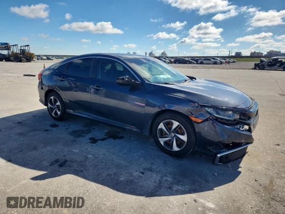 ✅ 2021 Honda Civic LX • VIN: 2HGFC2F6XMH520752 • Lot: 90006115. Listed on Copart with 77,412 mi. Free auction sales archive from the USA and detailed vehicle history report at DreamBid. Image 4.