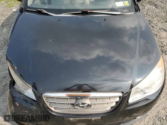 2007 Hyundai Elantra GLS z VIN KMHDU46D57U129969, wystawiony jako Copart lot #65534884 z przebiegiem 183 733 mil mil oraz Szkoda całkowita • Salvage title. Historia ofert i sprzedaży dostępna na DreamBid. Obrazek 11.