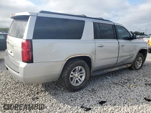 2015 Chevrolet Suburban LT with VIN 1GNSKJKC9FR147607, listed as a Copart auction lot 82344395 with 164,883 mi miles and Salvage title. Bid and sale history available at DreamBid. Image 3.