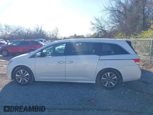 ✅ 2015 Honda Odyssey Touring Elite • VIN: 5FNRL5H99FB074655 • Lot: 43803030. Listed on IAAI with 153,633 mi. Free auction sales archive from the USA and detailed vehicle history report at DreamBid. Image 14.