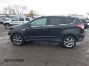 ✅ 2015 Ford Escape Titanium • VIN: 1FMCU9J9XFUB77087 • Lot: 43771373. Listed on IAAI with 95,650 mi. Free auction sales archive from the USA and detailed vehicle history report at DreamBid. Image 14.