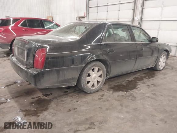 ✅ 2003 Cadillac DeVille DTS • VIN: 1G6KF57953U134219 • Lot: 41615872. Wystawiony na IAAI z przebiegiem 147 901 mil. Bezpłatny archiwum sprzedaży aukcyjnych z USA i szczegółowy raport historii pojazdu na DreamBid. Zdjęcie 4.