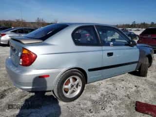 2003 Hyundai Accent with VIN KMHCF35C73U273610, listed as a Copart auction lot 85868294 with 168,203 mi miles and Salvage title. Bid and sale history available at DreamBid. Image 3.