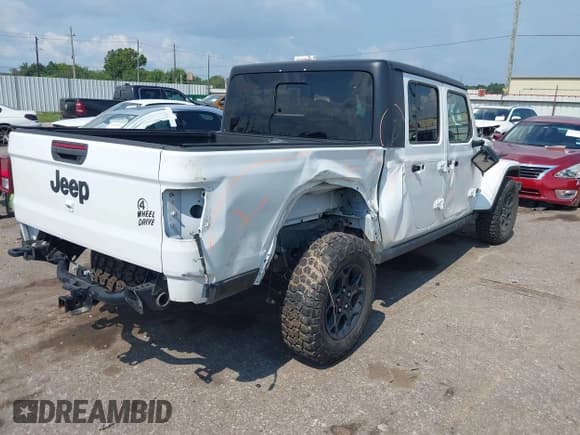 ✅ 2023 Jeep Gladiator Sport S • VIN: 1C6HJTAG6PL542989 • Lot: 42987749. Listed on IAAI with 14,847 mi. Free auction sales archive from the USA and detailed vehicle history report at DreamBid. Image 4.