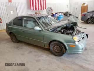 2005 Hyundai Accent GLS с VIN KMHCG35CX5U335467, выставлен на аукционе Copart как лот 61091895 с пробегом Не указан миль и Списание • Salvage title. История ставок и продаж доступна на DreamBid. Изображение 4.