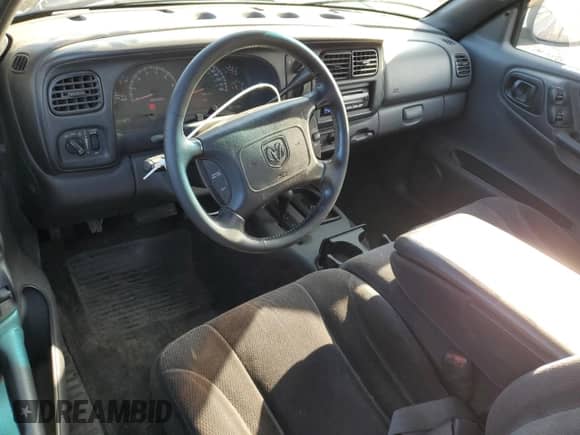 2000 Dodge Dakota Sport z VIN 1B7GG26N6YS599527, wystawiony jako Copart lot #73604624 z przebiegiem 102 127 mil mil oraz Czysty tytuł • Clean title. Historia ofert i sprzedaży dostępna na DreamBid. Obrazek 8.