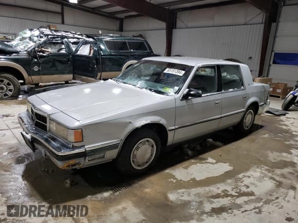 ✅ 1989 Dodge Dynasty • VIN: 1B3BC4634KD442902 • Lot: 85151394. Listed on Copart with 63,120 mi. Free auction sales archive from the USA and detailed vehicle history report at DreamBid. Image 1.