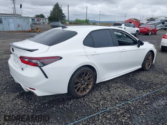 2023 Toyota Camry SE with VIN 4T1G11BKXPU103277, listed as a IAAI auction lot 41978396 with 66,624 mi miles and . Bid and sale history available at DreamBid. Image 4.