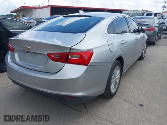 ✅ 2018 Chevrolet Malibu LT • VIN: 1G1ZD5ST0JF143540 • Lot: 42737601. Listed on IAAI with 142,193 mi. Free auction sales archive from the USA and detailed vehicle history report at DreamBid. Image 4.
