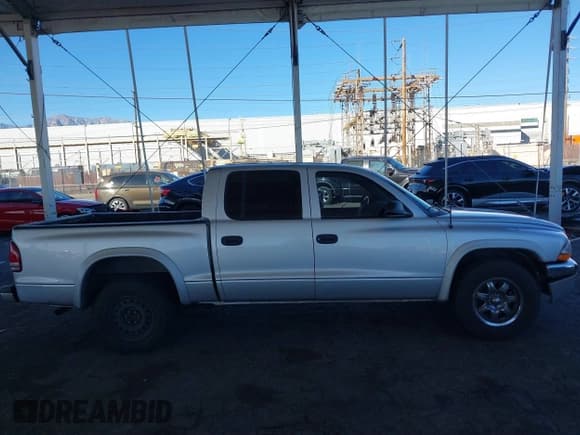 ✅ 2003 Dodge Dakota SLT • VIN: 1D7HL48N13S294573 • Lot: 41291127. Wystawiony na IAAI z przebiegiem 227 355 mil. Bezpłatny archiwum sprzedaży aukcyjnych z USA i szczegółowy raport historii pojazdu na DreamBid. Zdjęcie 13.