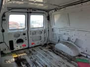 ✅ 2012 Ford Econoline Cargo Recreational • VIN: 1FTNE2EL0CDB33215 • Lot: 63120784. Wystawiony na Copart z przebiegiem 258 466 mil. Bezpłatny archiwum sprzedaży aukcyjnych z USA i szczegółowy raport historii pojazdu na DreamBid. Zdjęcie 11.