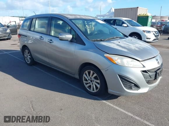 ✅ 2013 Mazda 5 Sport • VIN: JM1CW2BLXD0147656 • Lot: 43537281. Listed on IAAI with 68,627 mi. Free auction sales archive from the USA and detailed vehicle history report at DreamBid. Image 1.