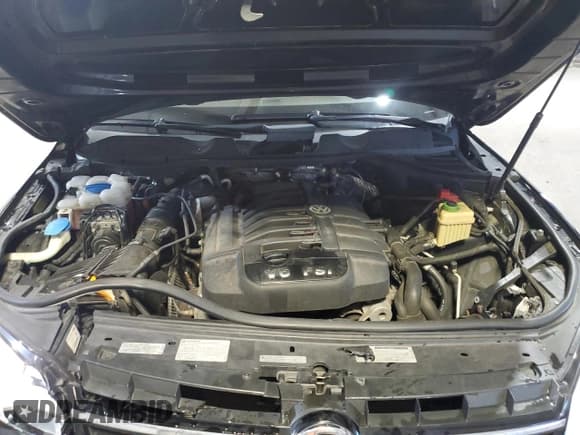 ✅ 2013 Volkswagen Touareg Exec • VIN: WVGEF9BP6DD007788 • Lot: 54606555. Listed on Copart with 167,879 mi. Free auction sales archive from the USA and detailed vehicle history report at DreamBid. Image 12.