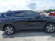 ✅ 2021 Hyundai Santa Fe SE • VIN: 5NMS14AJ0MH309235 • Lot: 41919206. Listed on IAAI with 41,453 mi. Free auction sales archive from the USA and detailed vehicle history report at DreamBid. Image 13.