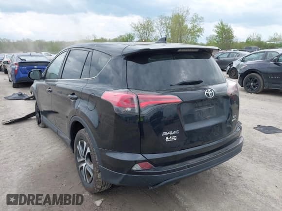 ✅ 2018 Toyota RAV4 LE • VIN: 2T3BFREVXJW763690 • Lot: 42171331. Listed on IAAI with 133,428 mi. Free auction sales archive from the USA and detailed vehicle history report at DreamBid. Image 3.