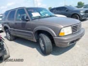 ✅ 1998 Oldsmobile Bravada • VIN: 1GHDT13WXW2702252 • Lot: 42861041. Listed on IAAI with 127,784 mi. Free auction sales archive from the USA and detailed vehicle history report at DreamBid. Image 1.