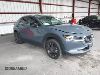 ✅ 2024 Mazda CX-30 S Carbon Edition • VIN: 3MVDMBCMXRM650611 • Lot: 43619427. Listed on IAAI with 34,494 mi. Free auction sales archive from the USA and detailed vehicle history report at DreamBid. Image 1.
