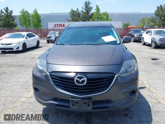 ✅ 2015 Mazda CX-9 Touring • VIN: JM3TB2CV0F0458812 • Lot: 42143019. Listed on IAAI with 147,257 mi. Free auction sales archive from the USA and detailed vehicle history report at DreamBid. Image 12.