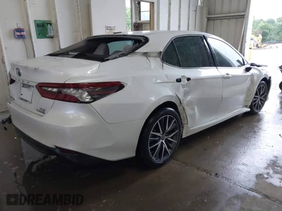2022 Toyota Camry Hybrid XLE with VIN 4T1F31AK4NU572580, listed as a IAAI auction lot 42244158 with 69,247 mi miles and . Bid and sale history available at DreamBid. Image 4.