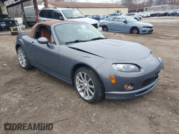 ✅ 2006 Mazda MX-5 Miata Sport • VIN: JM1NC25FX60120273 • Lot: 43774037. Listed on IAAI with 66,933 mi. Free auction sales archive from the USA and detailed vehicle history report at DreamBid. Image 1.