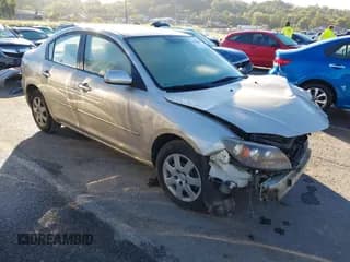 ✅ 2007 Mazda 3 i Sport • VIN: JM1BK12F771656243 • Лот: 43323460. Опубликован ранее на IAAI с пробегом 167 515 миль. Бесплатный доступ к архиву аукционных продаж из США и подробный отчёт об истории автомобиля на DreamBid. Изображение 1.