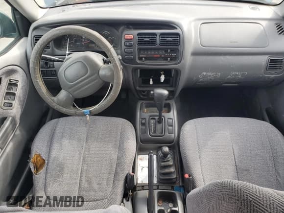 ✅ 1999 Suzuki Grand Vitara JLX • VIN: JS3TD62V0X4124366 • Лот: 50885055. Опубликован ранее на Copart с пробегом 204 168 миль. Бесплатный доступ к архиву аукционных продаж из США и подробный отчёт об истории автомобиля на DreamBid. Изображение 8.