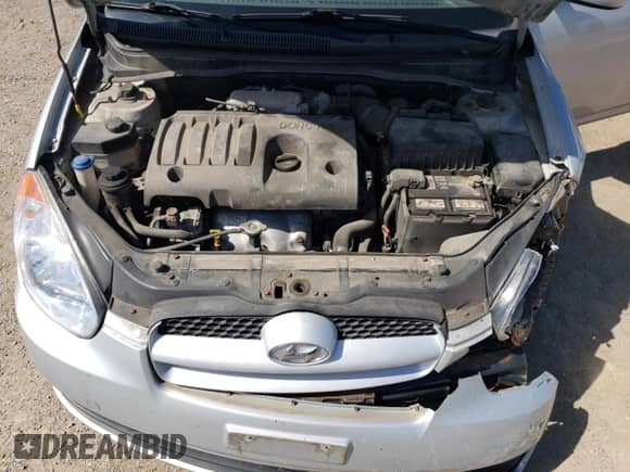 2010 Hyundai Accent L with VIN KMHCN3BCXAU182917, listed as a Copart auction lot 69464685 with 124,678 mi miles and Salvage title. Bid and sale history available at DreamBid. Image 11.