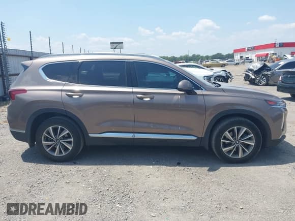 ✅ 2020 Hyundai Santa Fe SEL • VIN: 5NMS33AD3LH261307 • Lot: 42940601. Listed on IAAI with 95,444 mi. Free auction sales archive from the USA and detailed vehicle history report at DreamBid. Image 13.