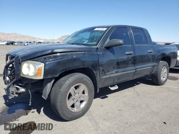 2006 Dodge Dakota SLT z VIN 1D7HE48N76S688934, wystawiony jako Copart lot #75057094 z przebiegiem 235 087 mil mil oraz Szkoda całkowita • Salvage title. Historia ofert i sprzedaży dostępna na DreamBid. Obrazek 1.