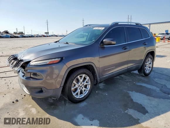 ✅ 2015 Jeep Cherokee Latitude • VIN: 1C4PJLCS5FW516841 • Lot: 84189215. Listed on Copart with 164,493 mi. Free auction sales archive from the USA and detailed vehicle history report at DreamBid. Image 1.