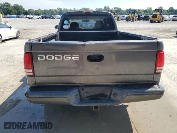 2002 Dodge Dakota Sport z VIN 1B7GL32XX2S588725, wystawiony jako Copart lot #65541345 z przebiegiem 205 568 mil mil oraz Szkoda całkowita • Salvage title. Historia ofert i sprzedaży dostępna na DreamBid. Obrazek 6.