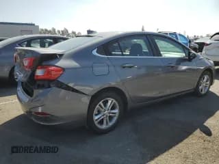 ✅ 2018 Chevrolet Cruze LT • VIN: 1G1BE5SM8J7117530 • Lot: 82191105. Listed on Copart with 81,767 mi. Free auction sales archive from the USA and detailed vehicle history report at DreamBid. Image 3.