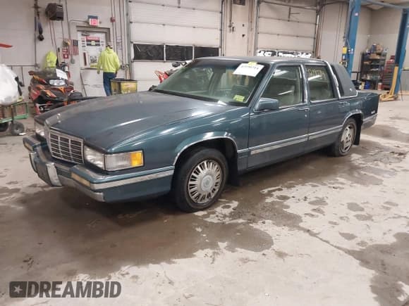 ✅ 1992 Cadillac DeVille • VIN: 1G6CD53B2N4227608 • Lot: 42190714. Listed on IAAI with 123,256 mi. Free auction sales archive from the USA and detailed vehicle history report at DreamBid. Image 2.