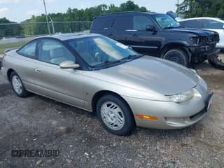 ✅ 1999 Saturn SC • VIN: 1G8ZY1277XZ229503 • Лот: 42435302. Опубликован ранее на IAAI с пробегом 217 039 миль. Бесплатный доступ к архиву аукционных продаж из США и подробный отчёт об истории автомобиля на DreamBid. Изображение 1.