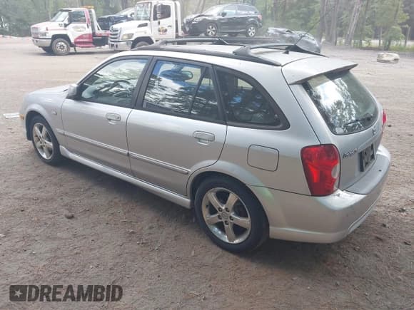 ✅ 2003 Mazda Protege • VIN: JM1BJ246831136374 • Lot: 43170826. Wystawiony na IAAI z przebiegiem 170 668 mil. Bezpłatny archiwum sprzedaży aukcyjnych z USA i szczegółowy raport historii pojazdu na DreamBid. Zdjęcie 3.