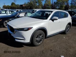 ✅ 2021 Mazda CX-5 Sport • VIN: JM3KFBBM6M0335229 • Lot: 85818885. Listed on Copart with 46,576 mi. Free auction sales archive from the USA and detailed vehicle history report at DreamBid. Image 1.