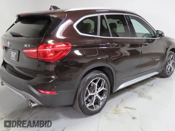 ✅ 2018 BMW X1 sDrive28i • VIN: WBXHU7C37J5L05511 • Лот: 85006215. Опубликован ранее на Copart с пробегом 25 925 миль. Бесплатный доступ к архиву аукционных продаж из США и подробный отчёт об истории автомобиля на DreamBid. Изображение 3.