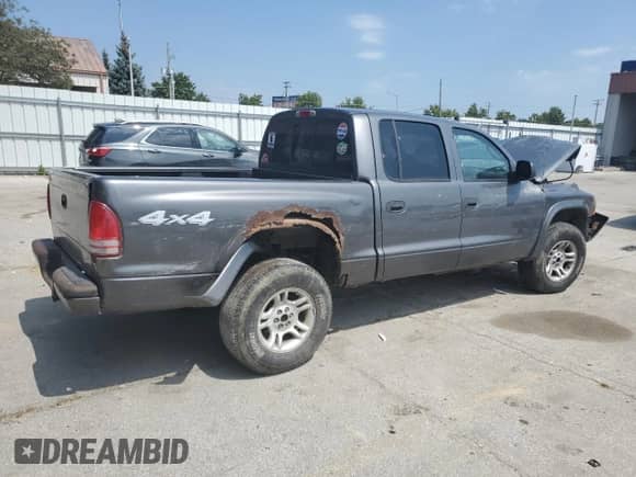2003 Dodge Dakota Sport z VIN 1D7HG38N93S323350, wystawiony jako Copart lot #68911784 z przebiegiem 137 395 mil mil oraz Czysty tytuł • Clean title. Historia ofert i sprzedaży dostępna na DreamBid. Obrazek 3.