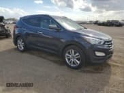 ✅ 2013 Hyundai Santa Fe Sport • VIN: 5XYZU3LAXDG016143 • Lot: 84069835. Listed on Copart with 123,787 mi. Free auction sales archive from the USA and detailed vehicle history report at DreamBid. Image 4.