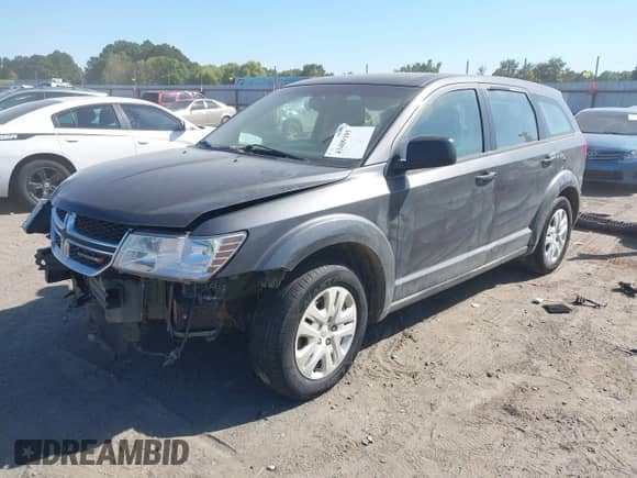 2015 Dodge Journey American Value z VIN 3C4PDCAB7FT559299, wystawiony jako IAAI lot #43409195 z przebiegiem 183 905 mil mil oraz . Historia ofert i sprzedaży dostępna na DreamBid. Obrazek 2.