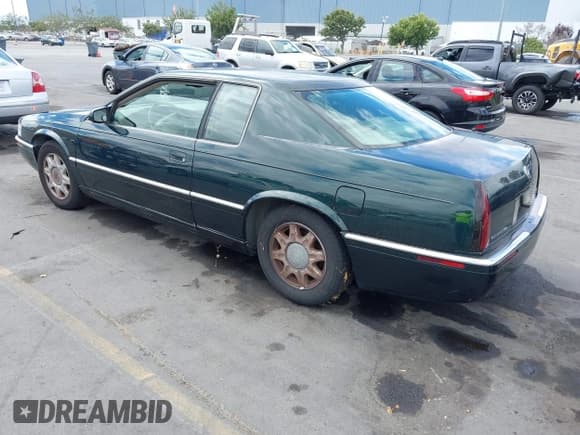 ✅ 1998 Cadillac Eldorado Touring • VIN: 1G6ET1299WU613236 • Lot: 43173727. Listed on IAAI with 165,556 mi. Free auction sales archive from the USA and detailed vehicle history report at DreamBid. Image 3.