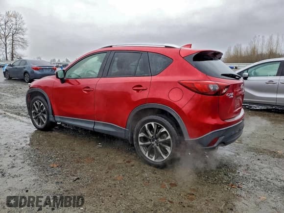 ✅ 2016 Mazda CX-5 Grand Touring • VIN: JM3KE4DY4G0703846 • Lot: 93990465. Listed on Copart with 86,638 mi. Free auction sales archive from the USA and detailed vehicle history report at DreamBid. Image 2.