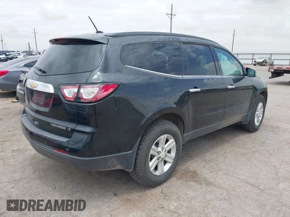 ✅ 2014 Chevrolet Traverse LT • VIN: 1GNKRHKD1EJ318053 • Lot: 42562508. Listed on IAAI with 93,544 mi. Free auction sales archive from the USA and detailed vehicle history report at DreamBid. Image 4.
