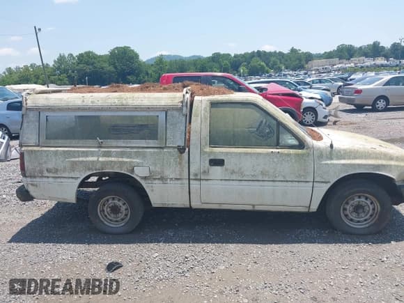 ✅ 1992 Isuzu Pickup S • VIN: 4S1CL11L3N4207154 • Lot: 42470949. Wystawiony na IAAI z przebiegiem 309 488 mil. Bezpłatny archiwum sprzedaży aukcyjnych z USA i szczegółowy raport historii pojazdu na DreamBid. Zdjęcie 13.