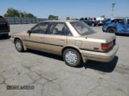 ✅ 1990 Toyota Camry • VIN: 4T1SV22E0LU247672 • Lot: 70946385. Wystawiony na Copart z przebiegiem 277 952 mil. Bezpłatny archiwum sprzedaży aukcyjnych z USA i szczegółowy raport historii pojazdu na DreamBid. Zdjęcie 2.