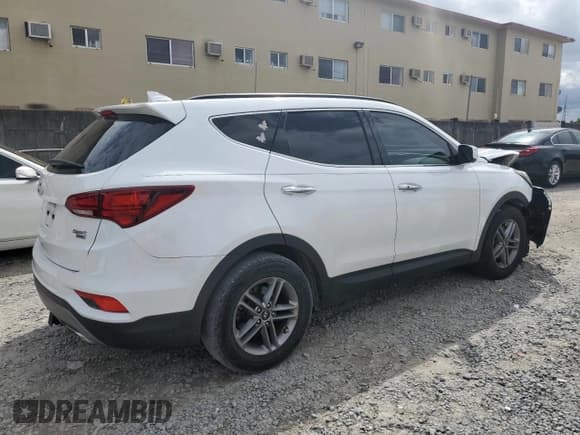 ✅ 2018 Hyundai Santa Fe 2.4L • VIN: 5NMZUDLB4JH104458 • Лот: 70008413. Опубликован ранее на Copart с пробегом 56 961 миль. Бесплатный доступ к архиву аукционных продаж из США и подробный отчёт об истории автомобиля на DreamBid. Изображение 3.