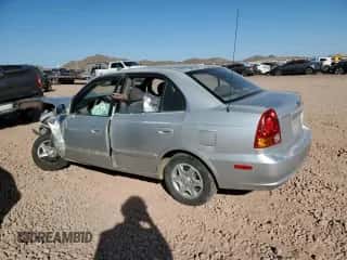 2003 Hyundai Accent GL z VIN KMHCG45CX3U429660, wystawiony jako Copart lot #43824125 z przebiegiem Nie podano mil oraz Szkoda całkowita • Salvage title. Historia ofert i sprzedaży dostępna na DreamBid. Obrazek 2.