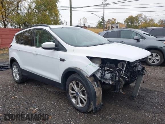 ✅ 2018 Ford Escape SE • VIN: 1FMCU0GD9JUC32631 • Lot: 43648621. Listed on IAAI with 86,643 mi. Free auction sales archive from the USA and detailed vehicle history report at DreamBid. Image 1.