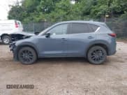 ✅ 2023 Mazda CX-5 S Carbon Edition • VIN: JM3KFBCM4P0142175 • Lot: 42523647. Listed on IAAI with 48,655 mi. Free auction sales archive from the USA and detailed vehicle history report at DreamBid. Image 15.